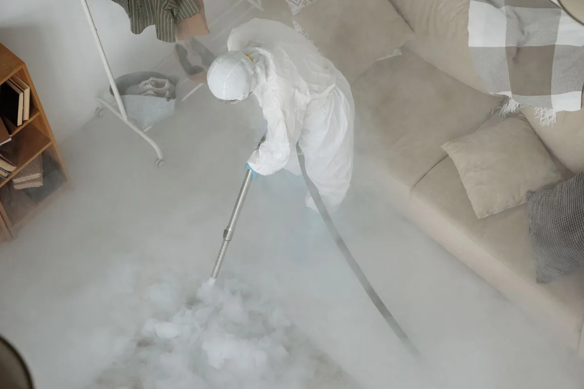 Biohazard cleanup technician in protective equipment, Gunbarrel, CO